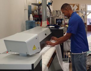 Man using flat ironer